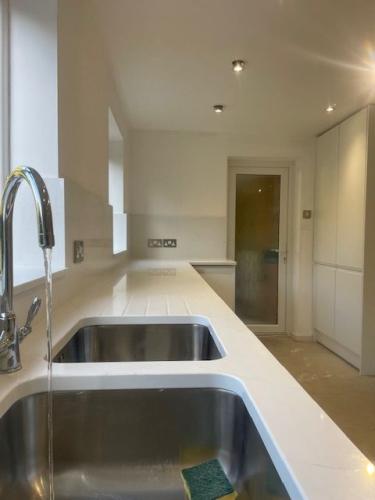 Complete refurbished new electrics new plumbing, Simple lines but effective with wall quartz cladding