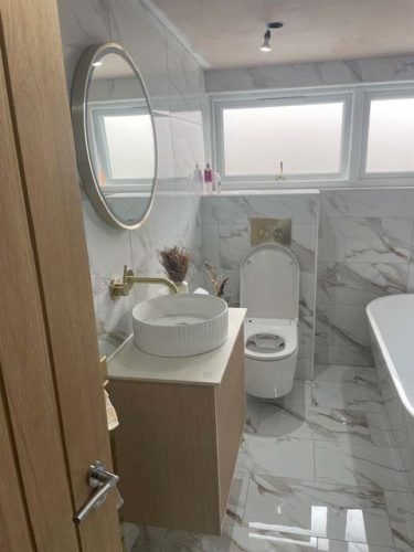 Another happy client now enjoys a separate bath and walk in shower